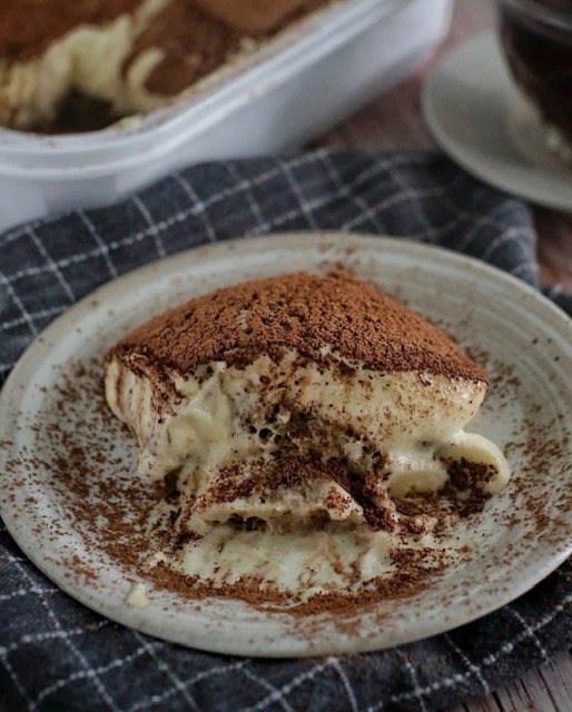 Close-up of mascarpone cake slice showing creamy layers